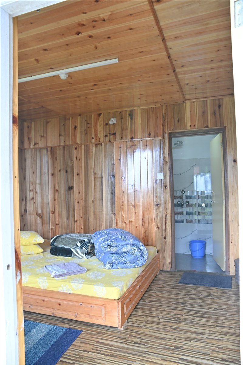 Kalimpong Alpine Cottage – Cozy Pine Timber Bedroom